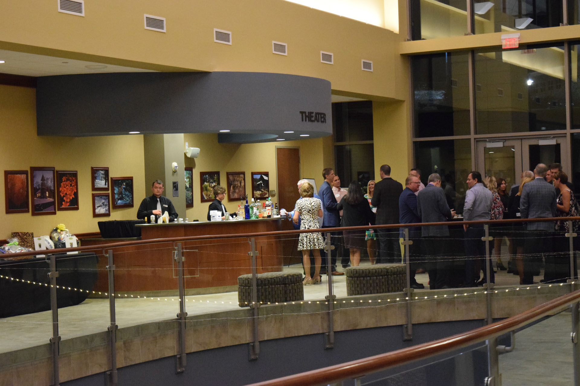 Group of People gathered at the Upper Atrium Front Desk at Anderson Center